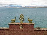 Tibet Kailash 07 Manasarovar 10 Gossul Gompa With Lake Lake Manasarovar (4560m), or Mapham Yum Tso (Victorious Lake) in Tibetan, is the most venerated of Tibet�s many lakes. Manasarovar has been circumambulated by Indian pilgrims for at least 1700 years when it was extolled in the sacred Sanskrit literature called the Puranas. Here is the view from Gossul Gompa.